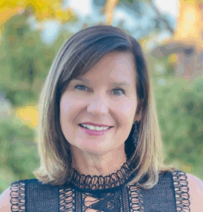 Headshot of women with short and black laced blouse.